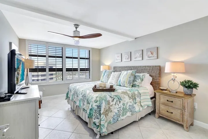 Tiled bedroom with ceiling fan