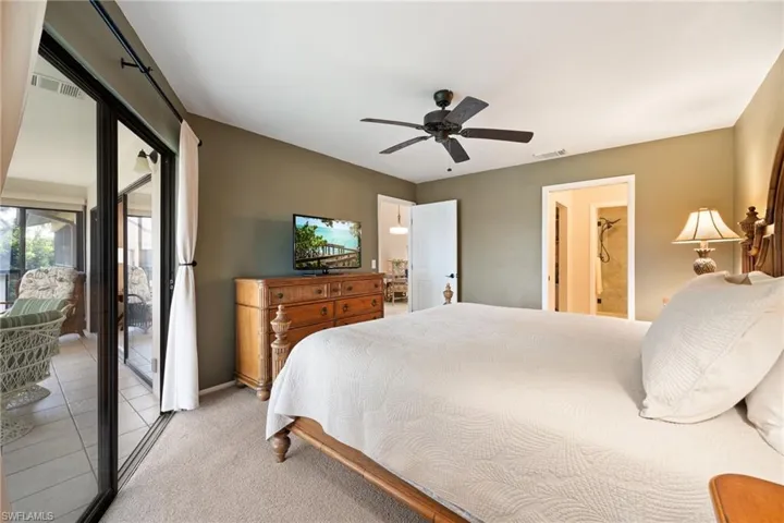 Bedroom featuring access to outside, ceiling fan, and light colored carpet