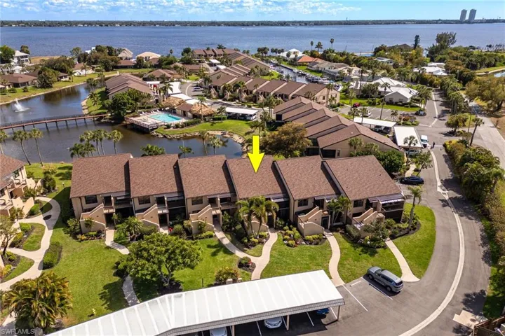 Aerial view of residential area featuring a large body of water