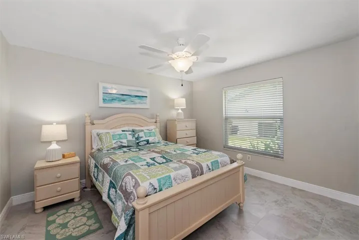 Bedroom with baseboards and a ceiling fan