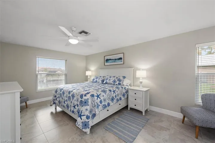 Bedroom with baseboards and ceiling fan