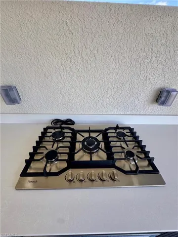 Kitchen view of stainless steel gas stovetop