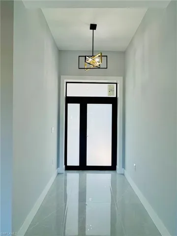 Entrance foyer featuring baseboards