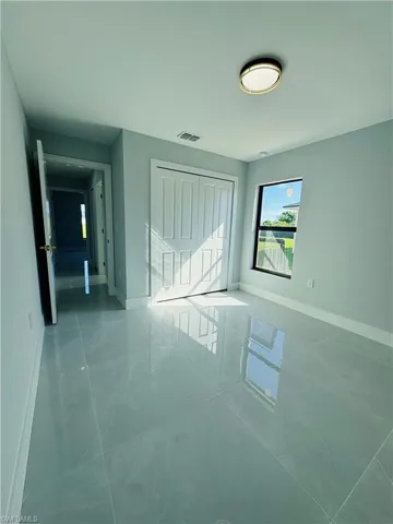 Unfurnished bedroom featuring baseboards