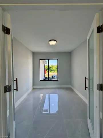 Unfurnished room featuring baseboards