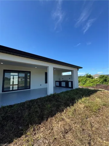 View of property exterior with stucco siding