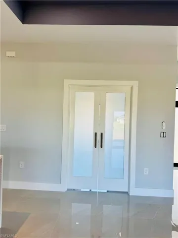 View of exterior entry featuring french doors