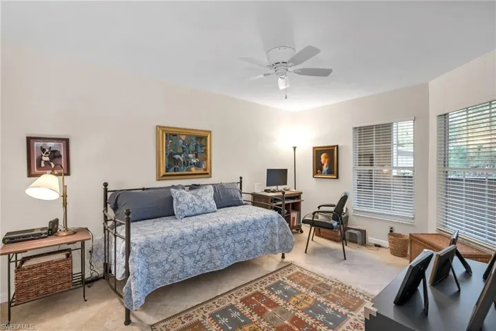 Comfortable guest bedroom with soft natural light.