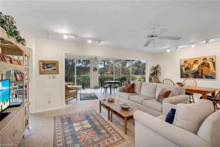 Bright living room with large windows and peaceful views.