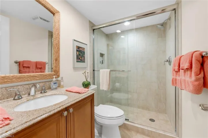 Guest bathroom with tub and clean finishes.