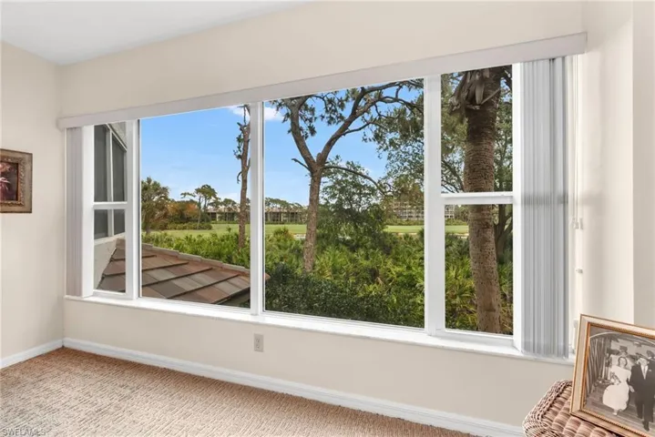 Large picture window in the primary bedroom.