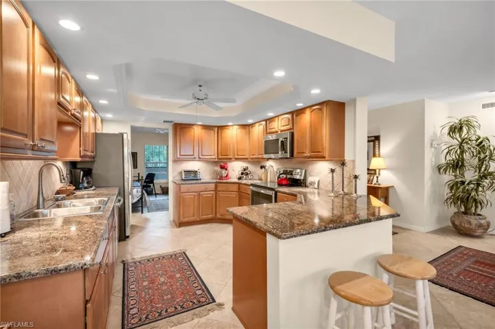 Kitchen and bar area with lots of storage and counter space.