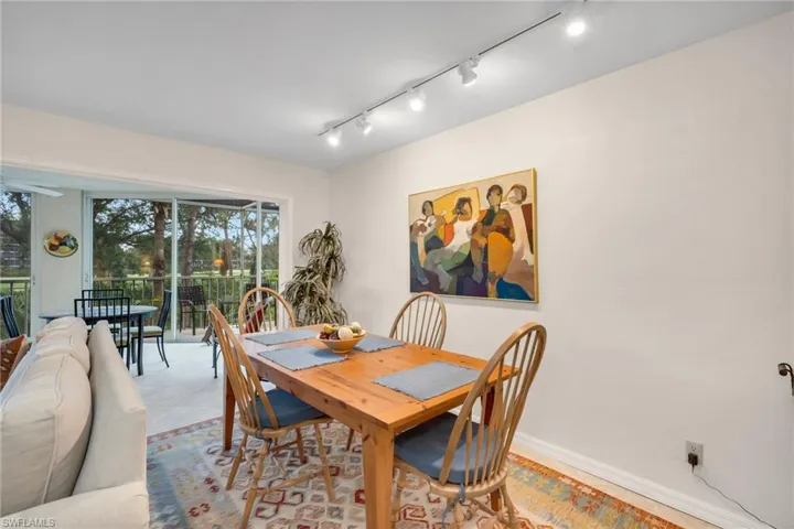Dining area with modern lighting and room for guests.