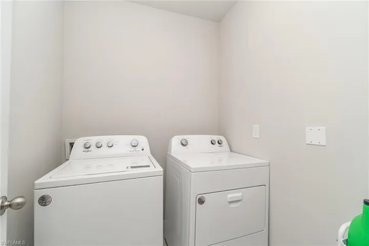 Laundry room with washing machine and dryer