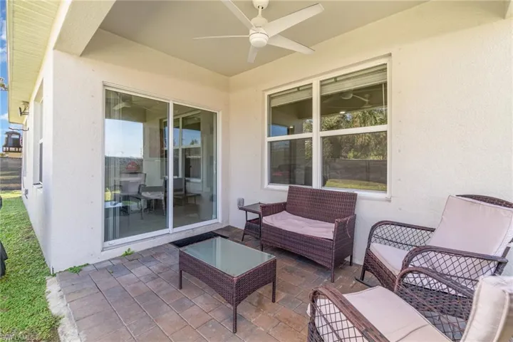 View of patio featuring ceiling fan and an outdoor hangout area