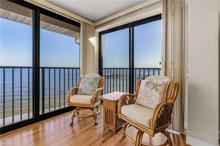 Sunroom / solarium with a water view