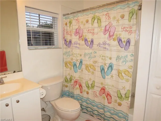 Full bathroom with vanity and toilet