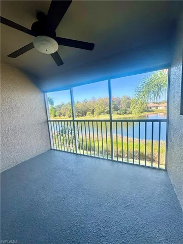 Unfurnished sunroom with a water view