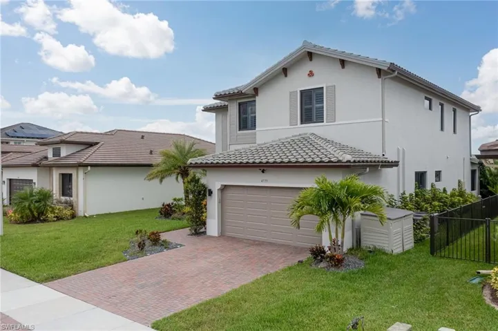 Mediterranean / spanish-style house featuring stucco siding, decorative driveway, and a tiled roof