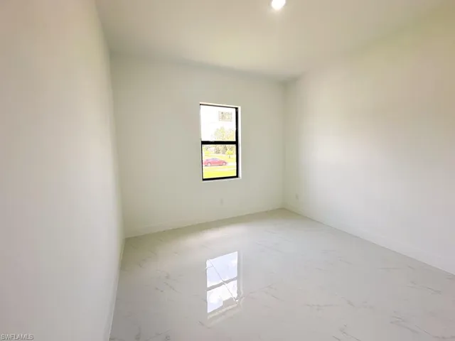 Unfurnished room featuring tile floors