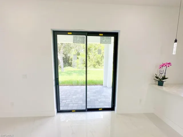Doorway to outside with tile floors