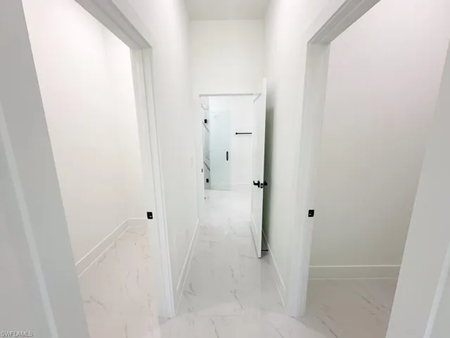 Hall featuring light tile flooring