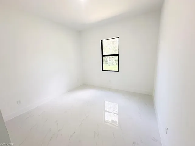 Empty room with tile flooring