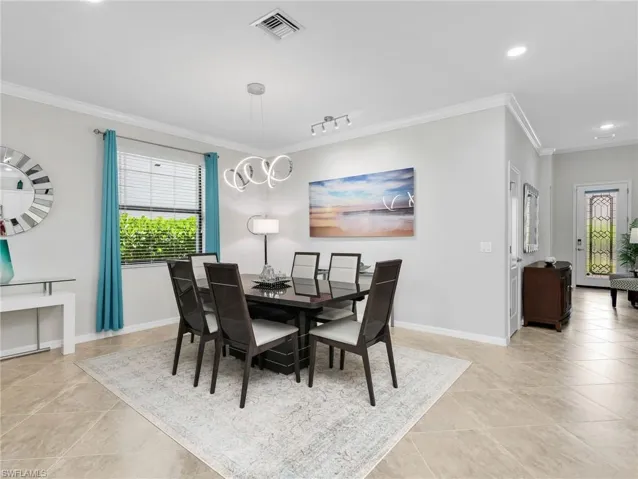 Living Room, Dining Room, & Kitchen Leading to Front Entry Foyer with Stained Glass Door