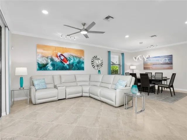 Screened In Lanai with Lake View, Paver Patio, AHT Electric Screen on Back Screen, Roll Down Screen on Side Screen, & Upgraded Landscaping