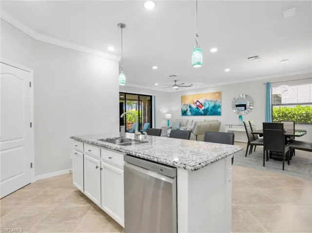 Kitchen with Island, White Shaker Cabinetry, Sparkling New Stainless Steel LG Appliances, Under & Above Counter Lighting, Crown Molding, & Pendant Lighting