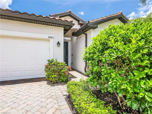 Front View with Landscaping & Paver Driveway