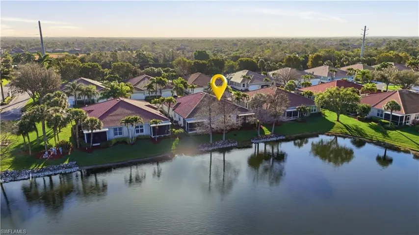 Aerial perspective of suburban area featuring a large body of water - Virtually Edited Image