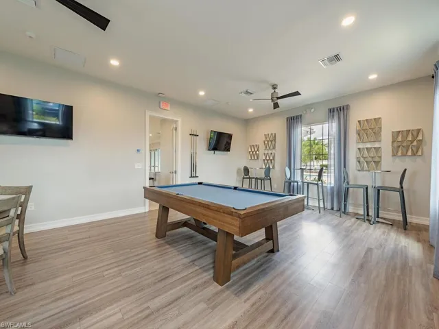 Game room featuring light hardwood / wood-style flooring, billiards, and ceiling fan