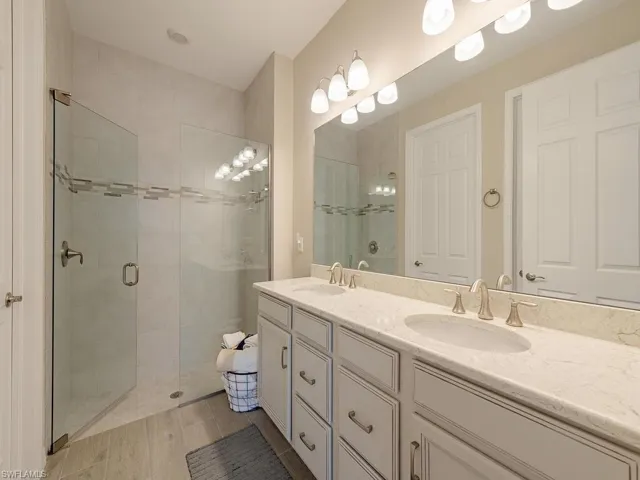 Bathroom with dual vanity and walk in shower