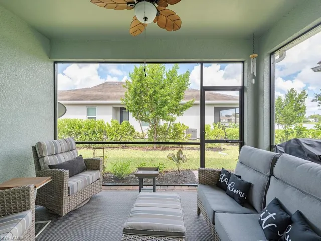 Sunroom featuring ceiling fan