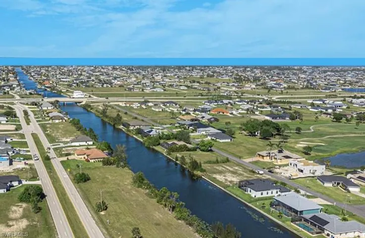 Aerial perspective of suburban area with a large body of water
