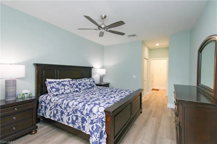 Bedroom featuring a closet, ceiling fan, and light hardwood / wood-style floors