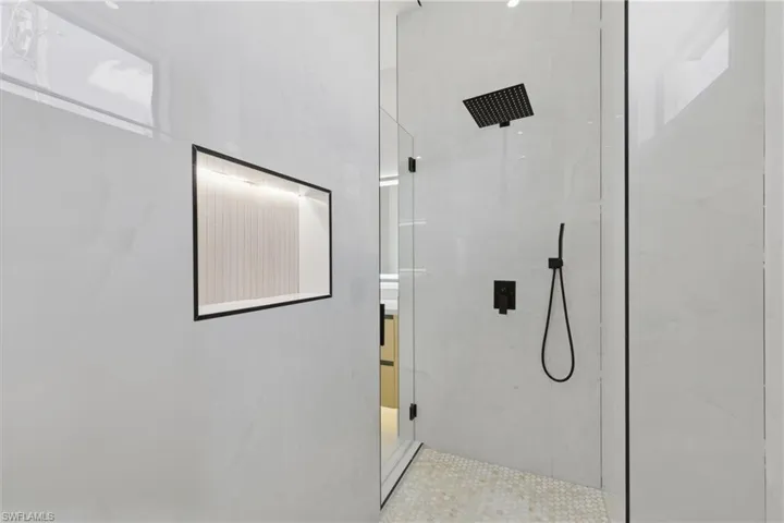 Full bathroom featuring a marble finish shower