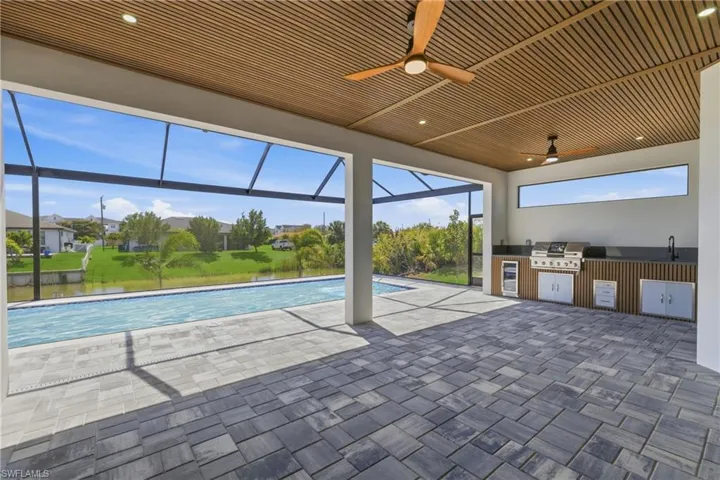 Unfurnished room with baseboards and ceiling fan