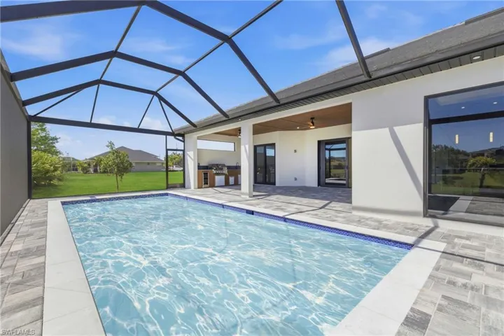 View of property location featuring a large body of water and nearby suburban area