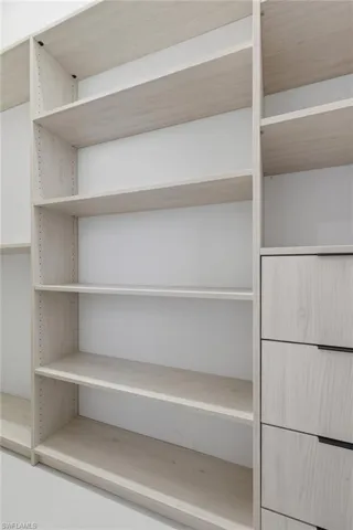 Full bathroom featuring vanity and a marble finish shower