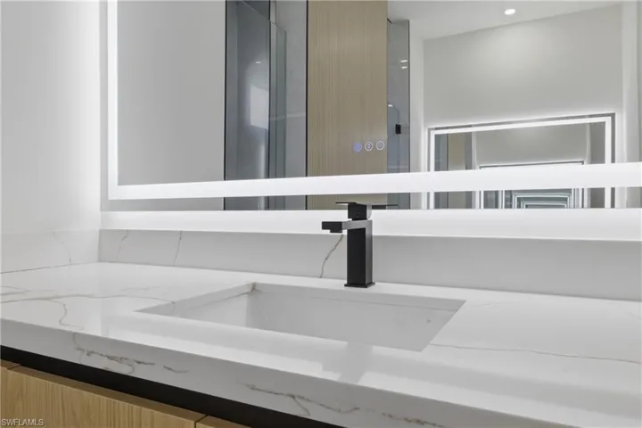 Full bathroom featuring vanity, a stall shower, a soaking tub, recessed lighting, and concrete floors