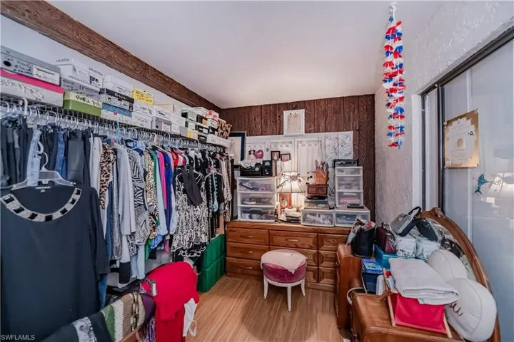 Spacious closet featuring light wood-type flooring