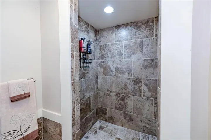 Bathroom featuring a tile shower