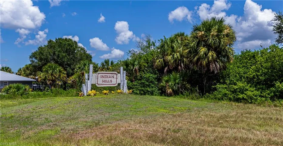 Community sign featuring a lawn