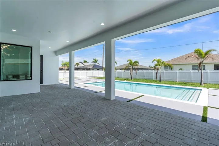 View of pool featuring a patio area and a fenced backyard