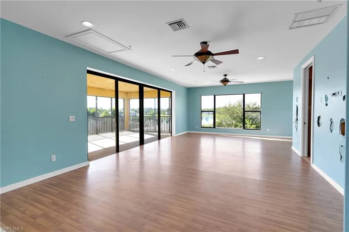 Spare room featuring hardwood / wood-style flooring and ceiling fan