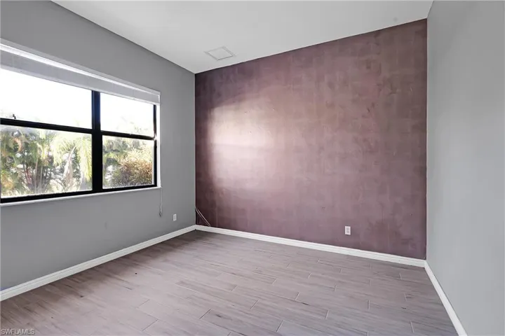 Empty room with light wood-type flooring