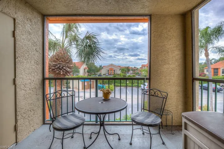 Balcony featuring a sunroom