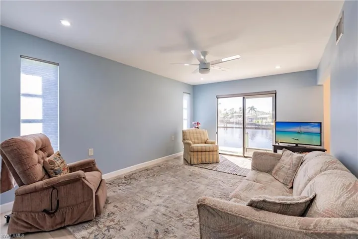 Living room featuring ceiling fan